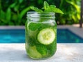 Refreshing cucumber mint drink by the pool