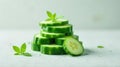 Refreshing cucumber slices with delicate green leaves, a culinary or cosmetic still life image featuring a stack of slices and a Royalty Free Stock Photo