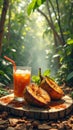 Refreshing cupuacu juice in tropical forest setting with fresh fruits and sunlight Royalty Free Stock Photo