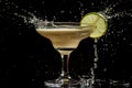 Refreshing daiquiri cocktail with a splash of lime against a black background Royalty Free Stock Photo