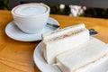 Refreshing and delicious breakfast with coffee latte and tuna sandwich Royalty Free Stock Photo