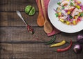 Refreshing dish of fish marinated in citrus juice on wooden table