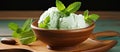 dessert of mint ice cream topped with fresh mint leaves on a rustic wooden tray Royalty Free Stock Photo