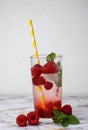 refreshing drink with raspberries and mint