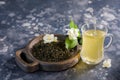 Refreshing drink in a glass cup with splash. Green tea with jasmine. Royalty Free Stock Photo