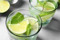 Refreshing drink with mint and lime in glasses on table Royalty Free Stock Photo
