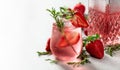 Gin and tonic cocktail with natural ice, strawberries, and rosemary Royalty Free Stock Photo