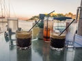 Refreshing drinks by the waterfront at sunset Royalty Free Stock Photo