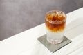 Refreshing espresso tonic drink on white wooden table, space for text Royalty Free Stock Photo