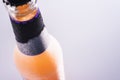 Refreshing frozen drink bottle  on gray background Royalty Free Stock Photo