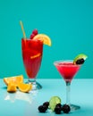Refreshing fruit cocktails on pastel turquoise background
