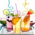 Refreshing fruit flavoured seltzer water with fruit garnish and crazy straws. Royalty Free Stock Photo