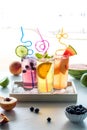 Refreshing fruit flavoured seltzer waters on a tray of ice with crazy straws. Royalty Free Stock Photo