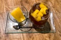 Refreshing fruit punch beverage in glass with ice-cream on wooden background Royalty Free Stock Photo