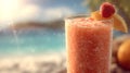 A close up of a fruit smoothie with a strawberry and orange slice on a beach background scene view Royalty Free Stock Photo