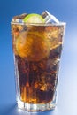 Refreshing glass of cola with lemon and ice