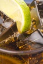 Refreshing glass of cola with lemon and ice Royalty Free Stock Photo