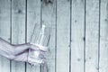 Refreshing glass of cold water being offered by male hand holding a glass