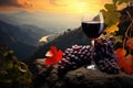 A refreshing glass of wine rests atop a rock, accompanied by a bunch of ripe, luscious grapes, A glass of rich red wine with