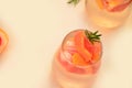 Refreshing grapefruit cocktail with ice and rosemary on a white background. rosemary on the table. or detox water or Royalty Free Stock Photo