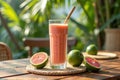 Refreshing grapefruit and lime smoothie in tropical garden setting Royalty Free Stock Photo
