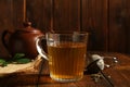 Refreshing green tea in cup on wooden table, closeup Royalty Free Stock Photo