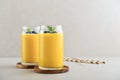 Refreshing and healthy mango smoothie with coconut flakes and fresh blueberries Royalty Free Stock Photo