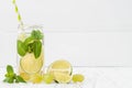 Refreshing homemade lime and mint cocktail over old vintage wooden table. Detox fruit infused flavored water. Clean eating Royalty Free Stock Photo