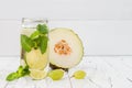 Refreshing homemade lime and mint cocktail over old vintage wooden table. Detox fruit infused flavored water. Clean eating Royalty Free Stock Photo