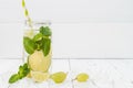 Refreshing homemade lime and mint cocktail over old vintage wooden table. Detox fruit infused flavored water. Clean eating Royalty Free Stock Photo