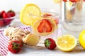 Refreshing homemade sparkling lemonade with fresh strawberry, lemon, ice and ginger. Healthy cold drink, low calories. Tasty cool Royalty Free Stock Photo