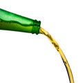 Ice cold beer pouring from green bottle. Stop action closeup on white Royalty Free Stock Photo