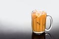 Refreshing ice cold coffee with milk in transparent glass Royalty Free Stock Photo