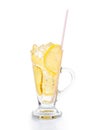 Refreshing ice cold ginger lemon tea in transparent glass on vertical orientation Royalty Free Stock Photo