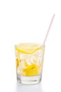 Refreshing ice cold ginger lemon tea in transparent glass on vertical orientation Royalty Free Stock Photo