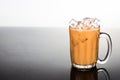 Refreshing ice cold tea with milk in transparent glass Royalty Free Stock Photo