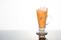 Refreshing ice cold tea with milk in transparent glass Royalty Free Stock Photo