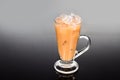 Refreshing ice cold tea with milk in transparent glass Royalty Free Stock Photo