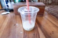 A Refreshing Ice Drink that has been drunk lies on a Wooden Table Royalty Free Stock Photo