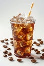 A refreshing iced coffee presented in a plastic takeaway glass, isolated on a clean white background. Royalty Free Stock Photo