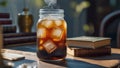 Iced coffee refreshment served in a glass jar with vintage books backdrop Royalty Free Stock Photo