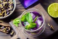 Refreshing iced organic blue and violet butterfly pea flower tea with mint and lime