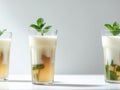 Refreshing iced tea drinks layered with milk and garnished with mint Royalty Free Stock Photo
