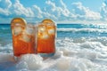 Refreshing iced tea drinks by the ocean waves Royalty Free Stock Photo