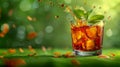 Refreshing Iced Tea with Lemon and Mint Leaves in Glass on Nature Background with Sunlight Bokeh