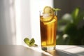 A refreshing iced tea served in a tall glass with a lemon wedge and a sprig of mint.Â 