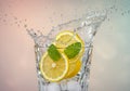 Refreshing Lemon and Mint Drink Splash in Glass Royalty Free Stock Photo