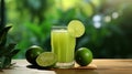 Refreshing lime juice in glass on wooden table with isolated green background for text placement