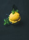 Refreshing Mango sorbet ice cream scoop in scooper, copy space Royalty Free Stock Photo
