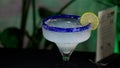 Refreshing margarita garnished with a lime slice, elegantly presented in a wine glass